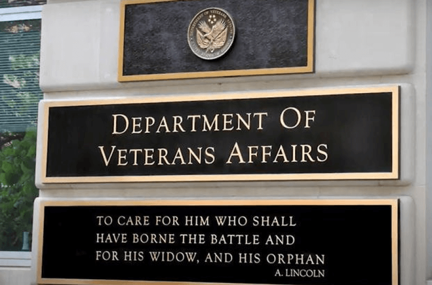 Plaques on an exterior wall: Department of Veteran Affairs seal. 